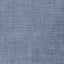 A closeup of the fabric of the blue chambray work shirt.