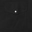 A black western style pocket with a pearl snap button.