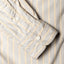 The barrel cuffs with two white buttons.