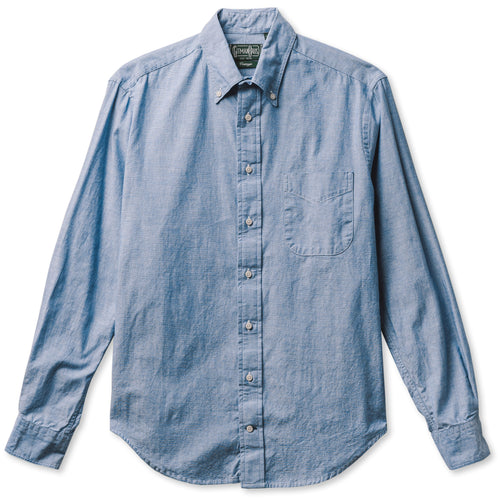 The Classic Chambray button down shirt, with a chest pocket, made from a chambray fabric with white buttons.