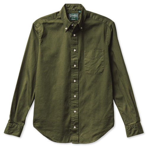 A long-sleeved, button-down olive overdyed Oxford shirt with a chest pocket, flat collar, and barrel cuffs. Gitman Vintage, 100% cotton, made in the USA.