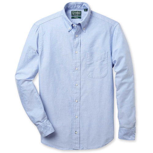 A blue Oxford shirt with a button-down collar, barrel cuffs, and a tacked, V-stitch chest pocket, made in the USA, 100% cotton.
